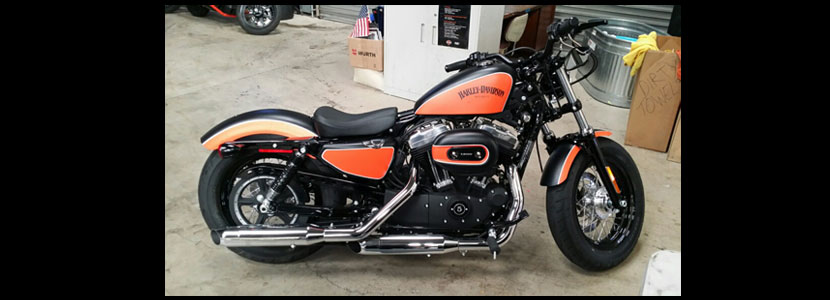orange and black hand painted custom Harley Davidson motorcycle by Kevin Walton Kiwi Customs